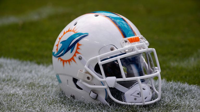 LANDOVER, MD - SEPTEMBER 13: A Miami Dolphins helmet sits on the grass before the start of their game against the Washington Redskins at FedExField on Sept