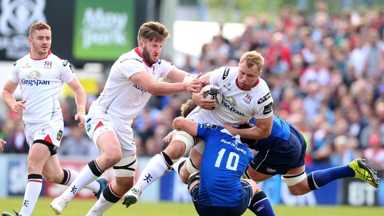 Ulster try-scorer Roger Wilson is tackled by Joey Carbery and Rhys Ruddock