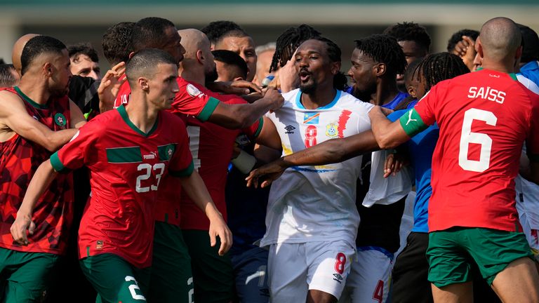 Players of Morocco and Congo argue after the final whistle