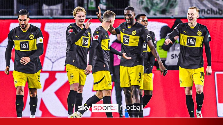 22 December 2024, Lower Saxony, Wolfsburg: Soccer: Bundesliga, VfL Wolfsburg - Borussia Dortmund, Matchday 15, Volkswagen Arena. Dortmund&#39;s Julian Brandt (M) applauds Dortmund&#39;s Serhou Guirassy after his goal to make it 0-3. Photo by: Swen Pf&#39;rtner/picture-alliance/dpa/AP Images