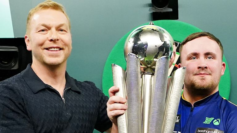 Sir Chris Hoy presents The Sid Waddell Trophy to Luke Littler after he won the Paddy Power World Darts Championship 