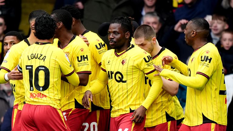 Watford's Tom Dele-Bashiru (centre) celebrates scoring his side's opener against Luton