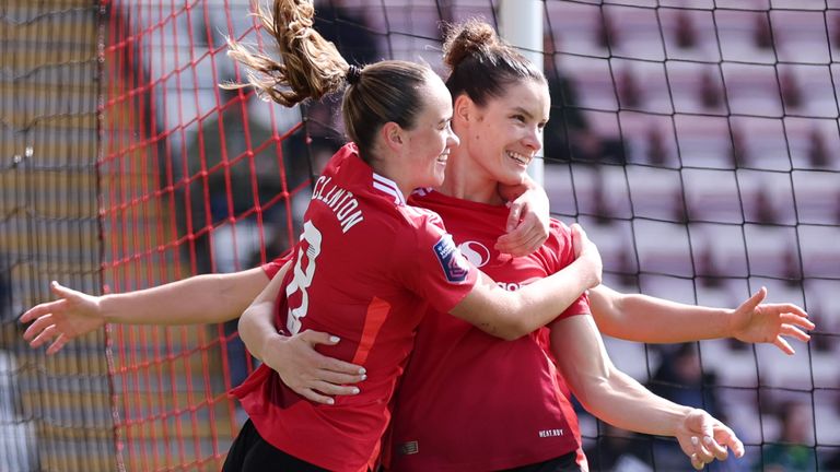 Dominique Janssen celebrates her goal wit team-mate Grace Clinton