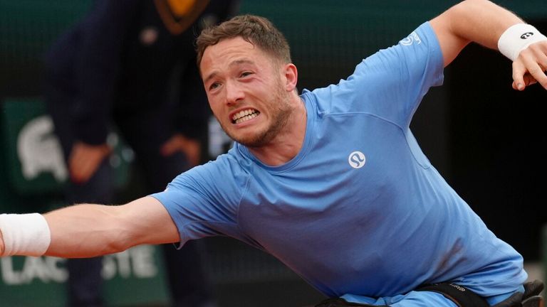 Alfie Hewett reaches for a shot against Japan's Tokito Oda during their men's wheelchair singles final at the French Open