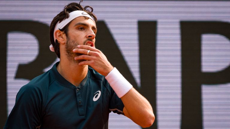 Lorenzo Musetti of Italy celebrates victory against Frances Tiafoe of United States during the Men's Singles Quarter Final match on Day Ten 