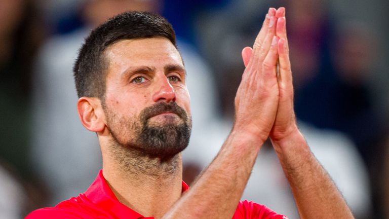 Novak Djokovic of Serbia acknowledges the crowd as he leaves the court after defeat against Jannik Sinner of Italy during the Men's Singles 