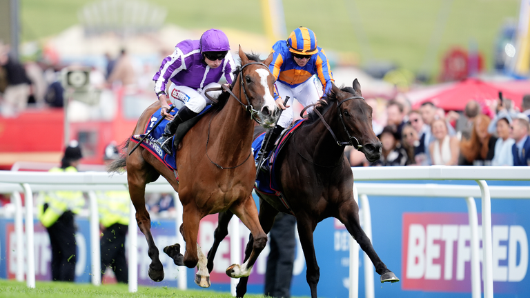 Minnie Hauk (left) beats stablemate Whirl in the 2025 Betfred Oaks
