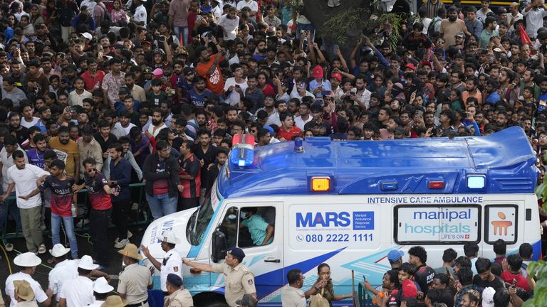 An ambulance arrives at the M. Chinnaswamy Stadium as fans gather to celebrate Royal Challengers Bengaluru cricketers, winners of the Indian Premier League, in Bengaluru, India, Wednesday, June 4, 2025. (AP Photo/Aijaz Rahi)